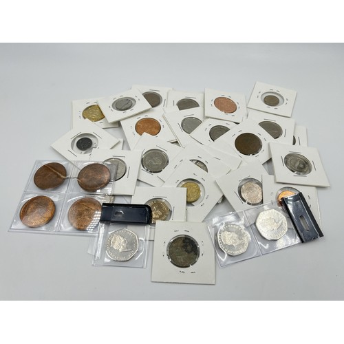 1237 - A collection of British coins to include penguin 50 pence, Falkland Islands etc.