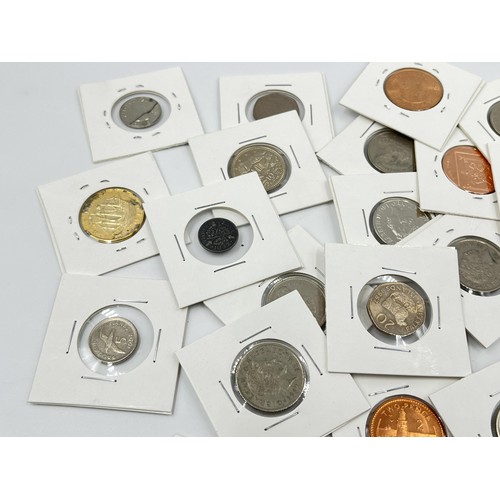 1237 - A collection of British coins to include penguin 50 pence, Falkland Islands etc.