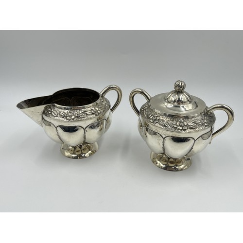 1163 - A .925 sterling silver milk jug and sugar bowl with floral design and gadrooning border - approx. gr... 