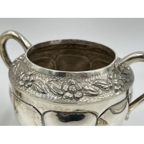 1163 - A .925 sterling silver milk jug and sugar bowl with floral design and gadrooning border - approx. gr... 