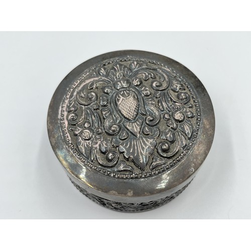 1167 - An .800 silver repousse circular trinket box - approx. gross weight 68.57 grams and 3cm high x 7cm d... 