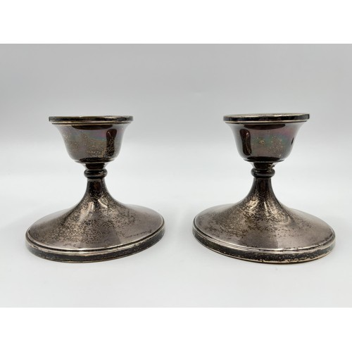 1169 - A pair of Henry Clifford Davis hallmarked Birmingham silver weighted dwarf candlesticks, dated 1961 ... 