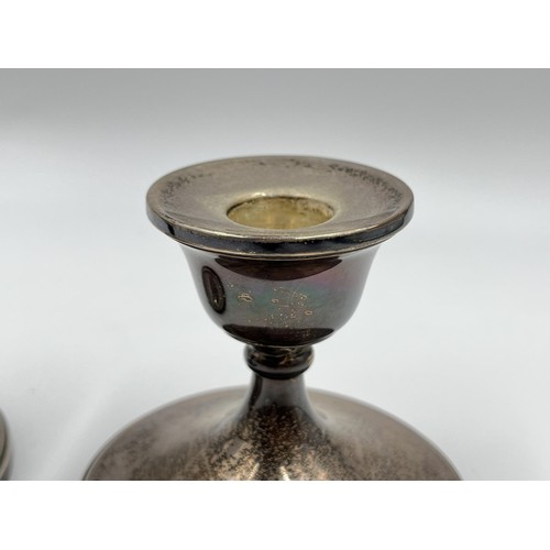 1169 - A pair of Henry Clifford Davis hallmarked Birmingham silver weighted dwarf candlesticks, dated 1961 ... 