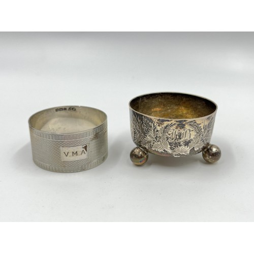 1173 - Two pieces of hallmarked sterling silver, one Victorian London tri footed circular salt cellar and o... 