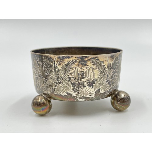 1173 - Two pieces of hallmarked sterling silver, one Victorian London tri footed circular salt cellar and o... 