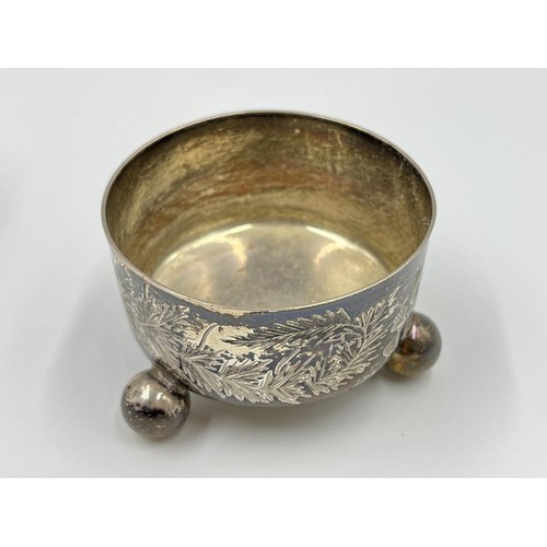 1173 - Two pieces of hallmarked sterling silver, one Victorian London tri footed circular salt cellar and o... 