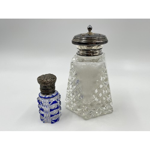 1175 - Two items, one blue cut glass scent bottle with white metal top and one cut glass salt shaker with h... 