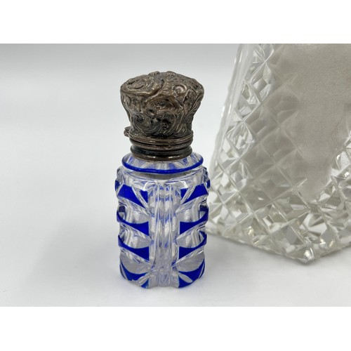 1175 - Two items, one blue cut glass scent bottle with white metal top and one cut glass salt shaker with h... 