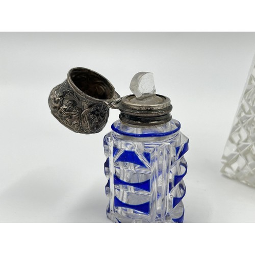 1175 - Two items, one blue cut glass scent bottle with white metal top and one cut glass salt shaker with h... 