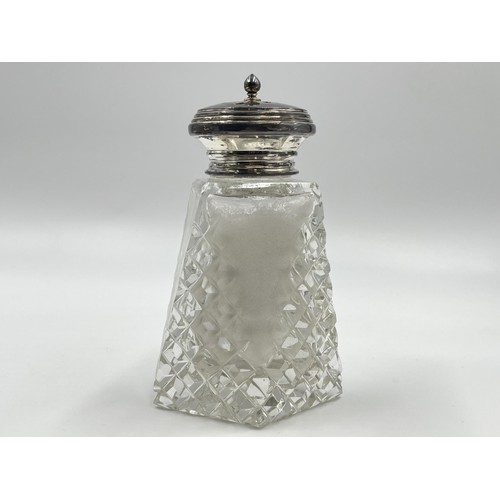 1175 - Two items, one blue cut glass scent bottle with white metal top and one cut glass salt shaker with h... 