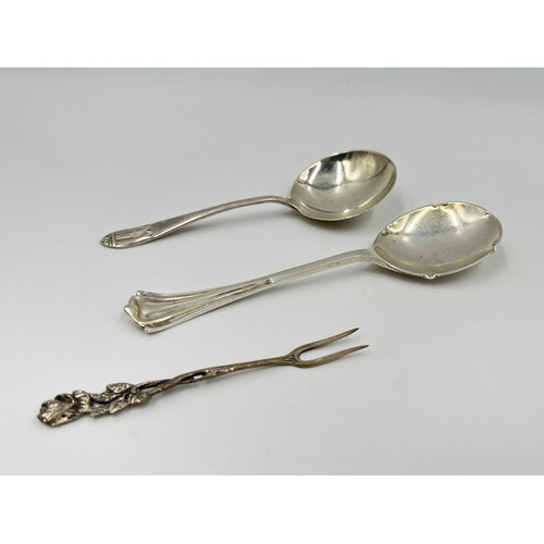 1176 - Three pieces of silver, one .800 silver pickle fork and two hallmarked Sheffield silver condiment sp... 