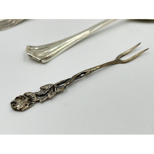 1176 - Three pieces of silver, one .800 silver pickle fork and two hallmarked Sheffield silver condiment sp... 