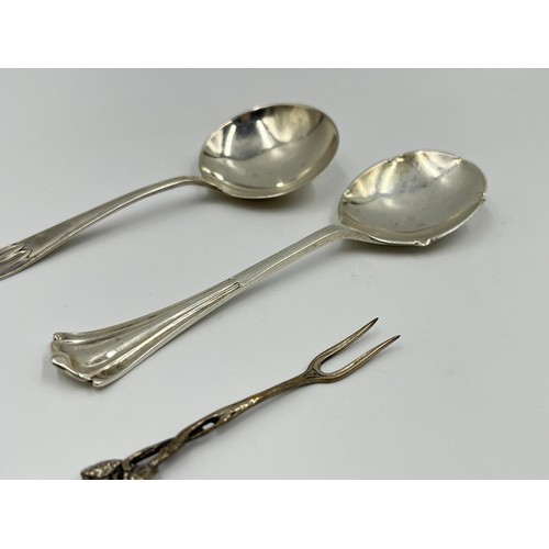 1176 - Three pieces of silver, one .800 silver pickle fork and two hallmarked Sheffield silver condiment sp... 