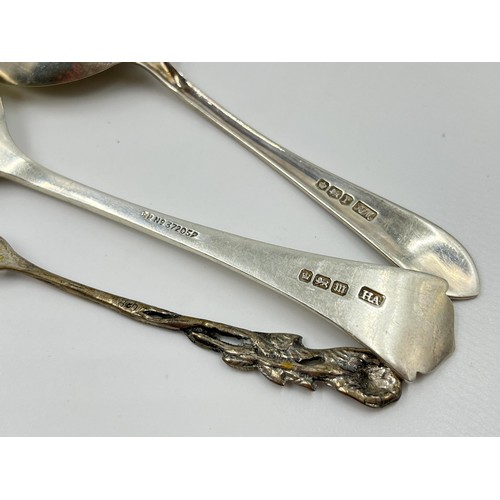 1176 - Three pieces of silver, one .800 silver pickle fork and two hallmarked Sheffield silver condiment sp... 