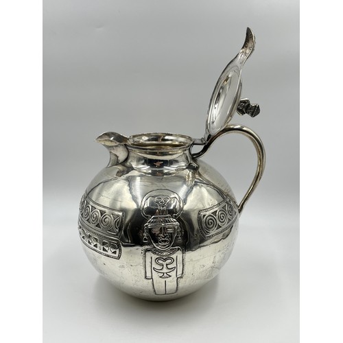 1183 - A Peruvian stamped .900 silver water jug - approx. gross weight 720 grams and 23cm high