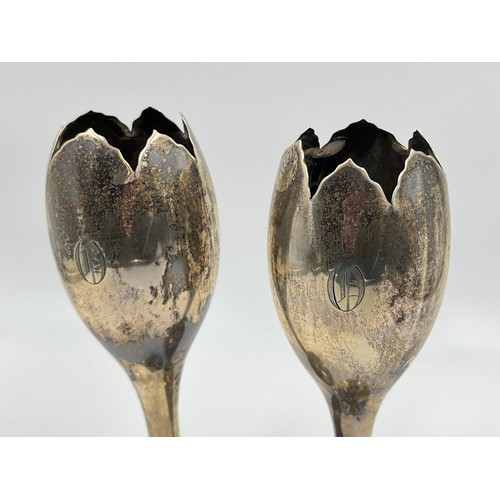 1184 - A pair of Walker & Hall hallmarked Sheffield silver weighted tulip vases, dated 1911 - approx. gross... 