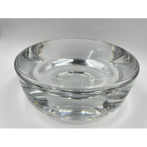 209 - A mid 20th century heavy clear glass circular footed bowl in the style of Willy Johansson for Hardel... 