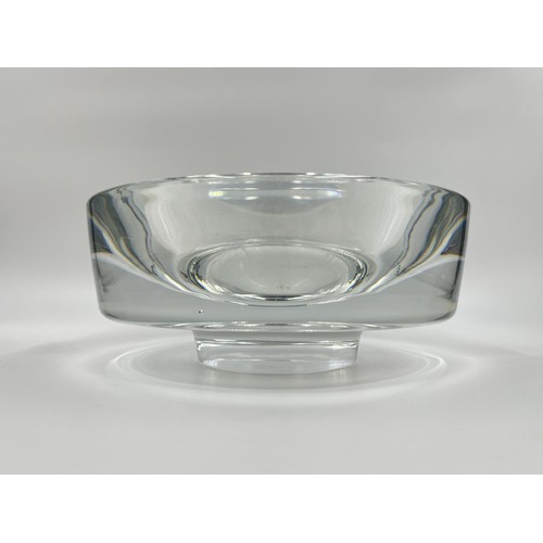 209 - A mid 20th century heavy clear glass circular footed bowl in the style of Willy Johansson for Hardel... 