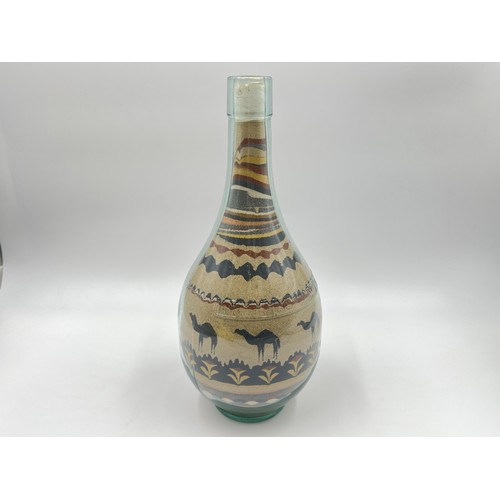 212 - A sand art bottle - approx. 26cm high