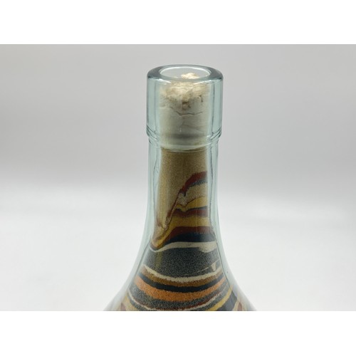 212 - A sand art bottle - approx. 26cm high