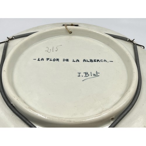 232 - A Spanish ceramic wall charger titled La Flor De La Alberca - approx. 31cm diameter