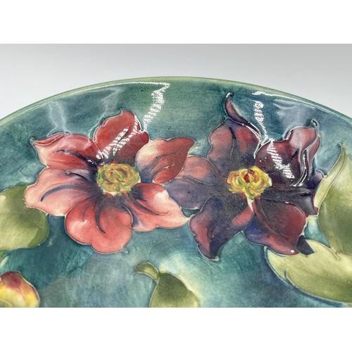 238 - A Moorcroft Clematis pattern circular pedestal bowl - approx. 6cm high x 19cm diameter