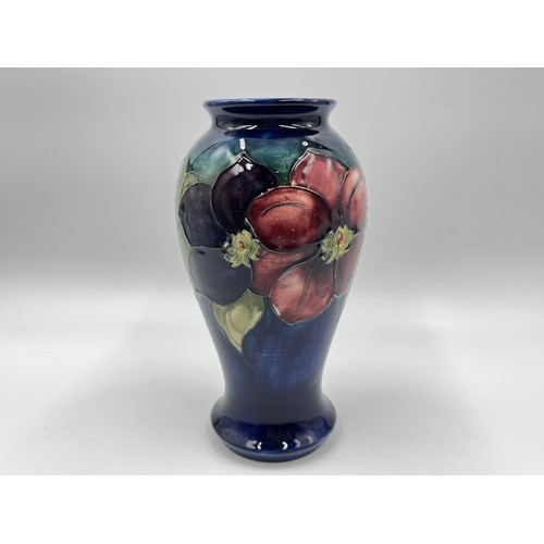 239 - A Moorcroft Clematis pattern baluster vase - approx. 18cm high