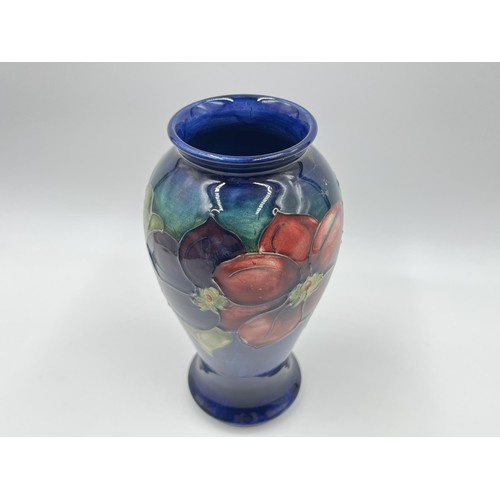 239 - A Moorcroft Clematis pattern baluster vase - approx. 18cm high