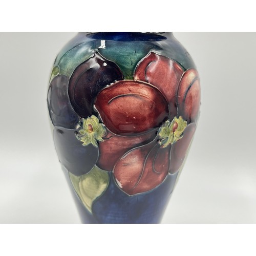 239 - A Moorcroft Clematis pattern baluster vase - approx. 18cm high