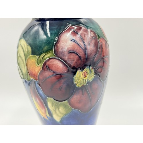 239 - A Moorcroft Clematis pattern baluster vase - approx. 18cm high