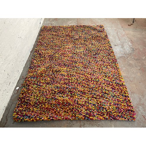 163 - A mid 20th century style multi coloured rug - approx. 225cm x 155cm