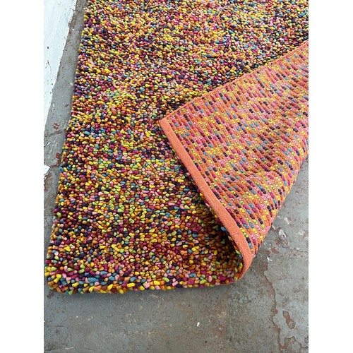 163 - A mid 20th century style multi coloured rug - approx. 225cm x 155cm