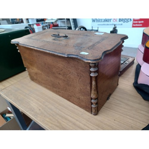 638 - A cased antique German hand-crank sewing machine