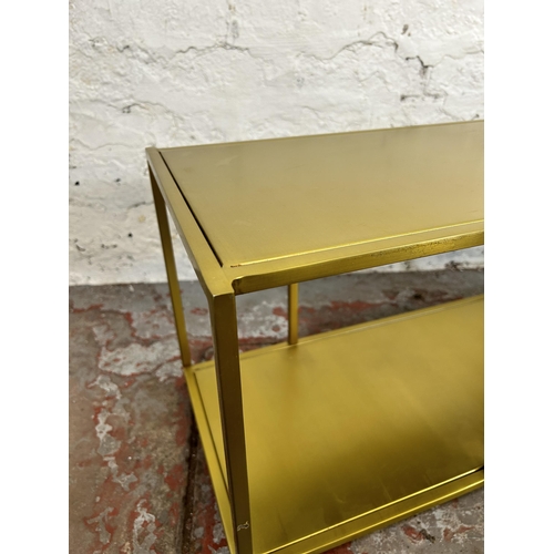 33 - A modern gilt metal rectangular two tier side table - approx. 35cm high x 90cm wide x 32cm deep