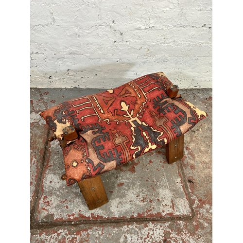 127 - A mid/late 20th century hardwood camel stool with cushion - approx. 39cm high x 40cm wide x 65cm lon... 