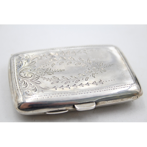 1304 - A George V hallmarked Birmingham silver cigarette case, dated 1921 - approx. gross weight 49 grams a... 