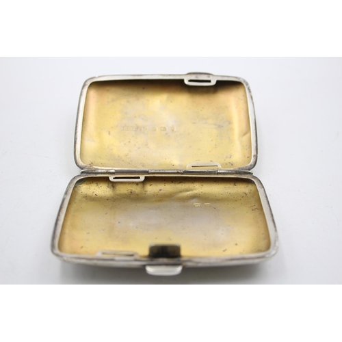 1304 - A George V hallmarked Birmingham silver cigarette case, dated 1921 - approx. gross weight 49 grams a... 