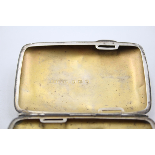 1304 - A George V hallmarked Birmingham silver cigarette case, dated 1921 - approx. gross weight 49 grams a... 