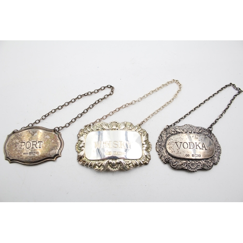 1310 - Three vintage hallmarked sterling silver decanter labels - approx. gross weight 35 grams