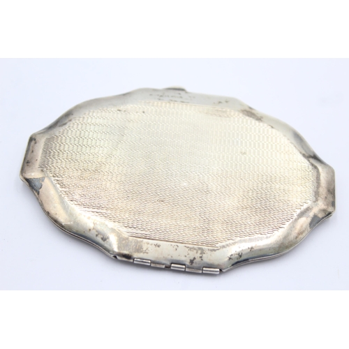 1313 - An R Davis & Co hallmarked Birmingham silver compact, dated 1944 - approx. gross weight 80 grams and... 