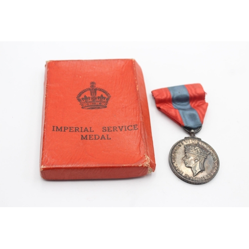 1351 - A boxed George VI Imperial Service medal awarded to Albert Ernest Roling