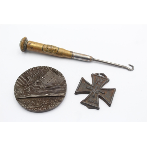 1359 - A WWI R.M.S Lusitania medal, Iron Cross and trench art button hook