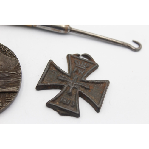 1359 - A WWI R.M.S Lusitania medal, Iron Cross and trench art button hook