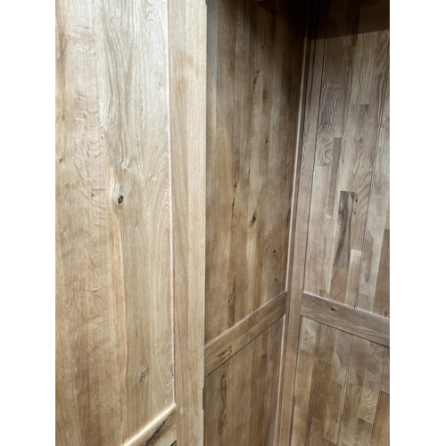 1 - A modern oak double wardrobe - approx. 193cm high x 109cm wide x 58cm deep