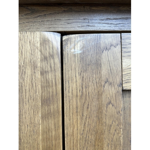 1 - A modern oak double wardrobe - approx. 193cm high x 109cm wide x 58cm deep