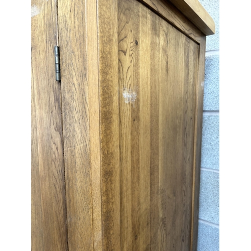 1 - A modern oak double wardrobe - approx. 193cm high x 109cm wide x 58cm deep