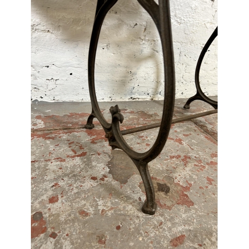 108 - An early 20th century mahogany and wrought iron sewing table - approx. 65cm high x 84cm wide x 44cm ... 