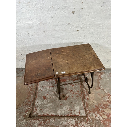 108 - An early 20th century mahogany and wrought iron sewing table - approx. 65cm high x 84cm wide x 44cm ... 