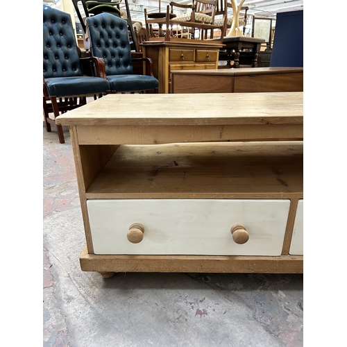 11 - A modern pine and white painted TV stand