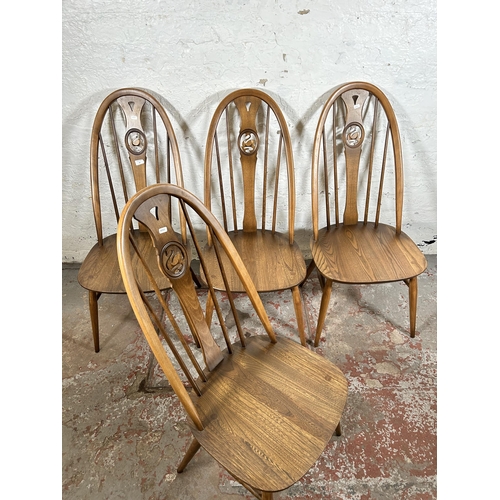 13 - Four Ercol model 876 elm and beech swan back dining chairs